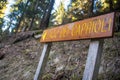 Signpost on the forest pathway with sign Lago dei Caprioli Royalty Free Stock Photo