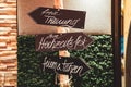 Signpost with german inscriptions for guests at wedding.Signs directing with arrows where to go for wedding ceremony