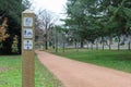 Signpost indicating a shared footpath and keep dogs on lead on a walking track