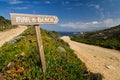 Signpost pointing to the beach at La Revellata in Corsica Royalty Free Stock Photo