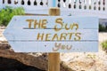 Signpost with the text the sun hearts you Royalty Free Stock Photo