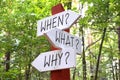 When? What? Why? - signpost with three arrows Royalty Free Stock Photo