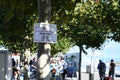 Signpost on tree in port of Constance on Lake Constance in Germany.