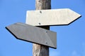 Wooden signpost with two arrows Royalty Free Stock Photo