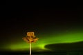 Signpost under the aurora in Stirling point