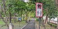 Signposts alerting people to social distancing in the park