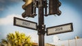 Signposts the direct way to 2028 versus 2027 Royalty Free Stock Photo