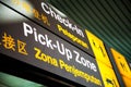 Signs at the airport Check-in and Pick-Up Zone