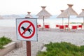 Signs announcing the ban on dogs on the beach. Royalty Free Stock Photo