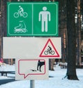 Signs for bicycle and pedestrian zone in park. Royalty Free Stock Photo