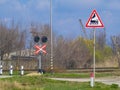 Signs for cars at railway crossing Royalty Free Stock Photo