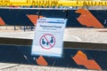 Signs and cordon tape blocking children`s playground during covid-19 pandemic Royalty Free Stock Photo