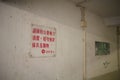 Signs in the corridor of an old public housing complex, Hong Kong