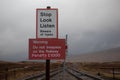 Signs at Corrour railway station, Scotland warning against trespass