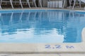 signs of depth in meters in swimming pool  deep pool with blue water Royalty Free Stock Photo