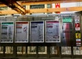 Signs for the different colored CTA train lines hang in station at State & Lake Streets in downtown Chicago Loop