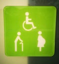 Signs for disabled people, elderly, pregnant women White on a green background Royalty Free Stock Photo