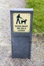 Dog leash sign in the park Royalty Free Stock Photo