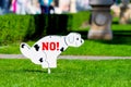 Signs forbidding dogs from entering and dumping dung on the lawn