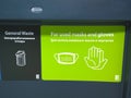 Signs on garbage container for used masks and contaminated gloves, general waste, wipes. Disposal safely problem. Protect rubbish