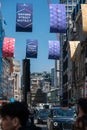 Signs hanging over the road on Oxford Street advertising the plans for a greener, smarter Oxford Street District with London black Royalty Free Stock Photo