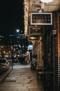 Signs outside Bottles wine bar in Spitalfields Market, London, Uk, selective focus