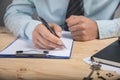 Man signs papers Royalty Free Stock Photo