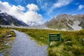 High rocky mountains and green grass in summer in New Zealand Royalty Free Stock Photo