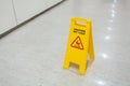 Signs plastic yellow put on floor text caution wet floor Royalty Free Stock Photo