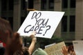 Signs of protesters marching on Broadway in downtown Manhattan, New York, NY, USA