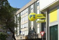 Signs of PT Poste Italiane and its bank brand Postamat outside a local city branch.