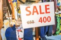Signs on sale, Discounted clothing department, The outdoor market