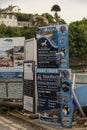 Signs showing tourists trips available from Portree, Isle of Skye, Scotland, UK