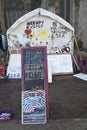 Signs and white tent in the Occupy Exeter camp Royalty Free Stock Photo