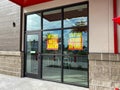 Signs in the window of an Earthfare grocery retail store going out of business Royalty Free Stock Photo