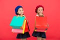 Signs you are addicted to shopping. Kids cute schoolgirls hold bunch shopping bags. Children pupils satisfied by