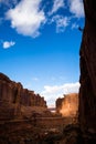 Sihlouette of man rappelling off of tall cliff in the sandstone desert of Southern Utah Royalty Free Stock Photo