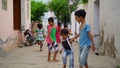 Sikar, Rajasthan, India - Aug 2020: Unidentified indian children playing and posing at the village street in India Royalty Free Stock Photo