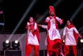 Sikh artists performing Bhangra dance on stage