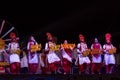 Sikh artists performing Bhangra dance on stage