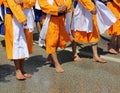 Sikh barefoot soldiers wear an orange dress Royalty Free Stock Photo