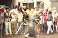 A sikh boy showing his own talent, he is broken the electronic glas tube hit his head