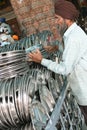 Sikh collecting plates in Golden Temple's kitchen