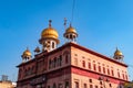 Sikh holy religious gurudwara with dome with bright blue sky