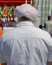 Sikh man with a pink turban during a religious ceremony