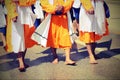 sikh men with orange clothes during religious ceremony with old Royalty Free Stock Photo