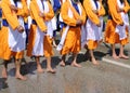 sikh men with orange clothes during religious ceremony Royalty Free Stock Photo