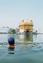 Sikh pilgrim praying in  holy tank near Golden Temple Sri Harmandir Sahib, Amritsar, INDIA Royalty Free Stock Photo