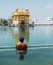 Sikh pilgrim praying in  holy tank near Golden Temple Sri Harmandir Sahib, Amritsar, INDIA Royalty Free Stock Photo