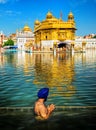 Sikh prayer in lake of Golden Temple, Amritsar, India